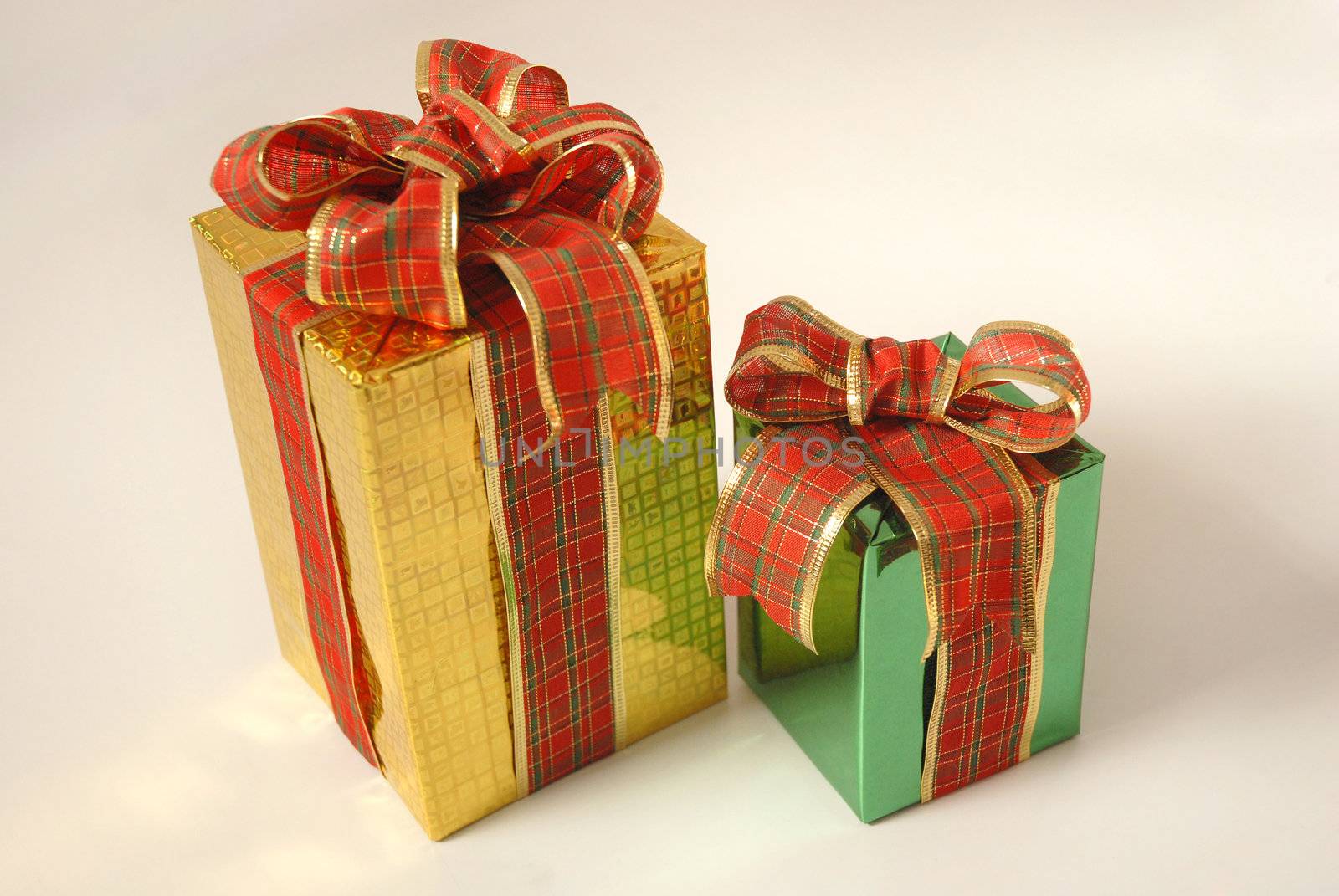 Gift boxes with red and golden ribbons. 