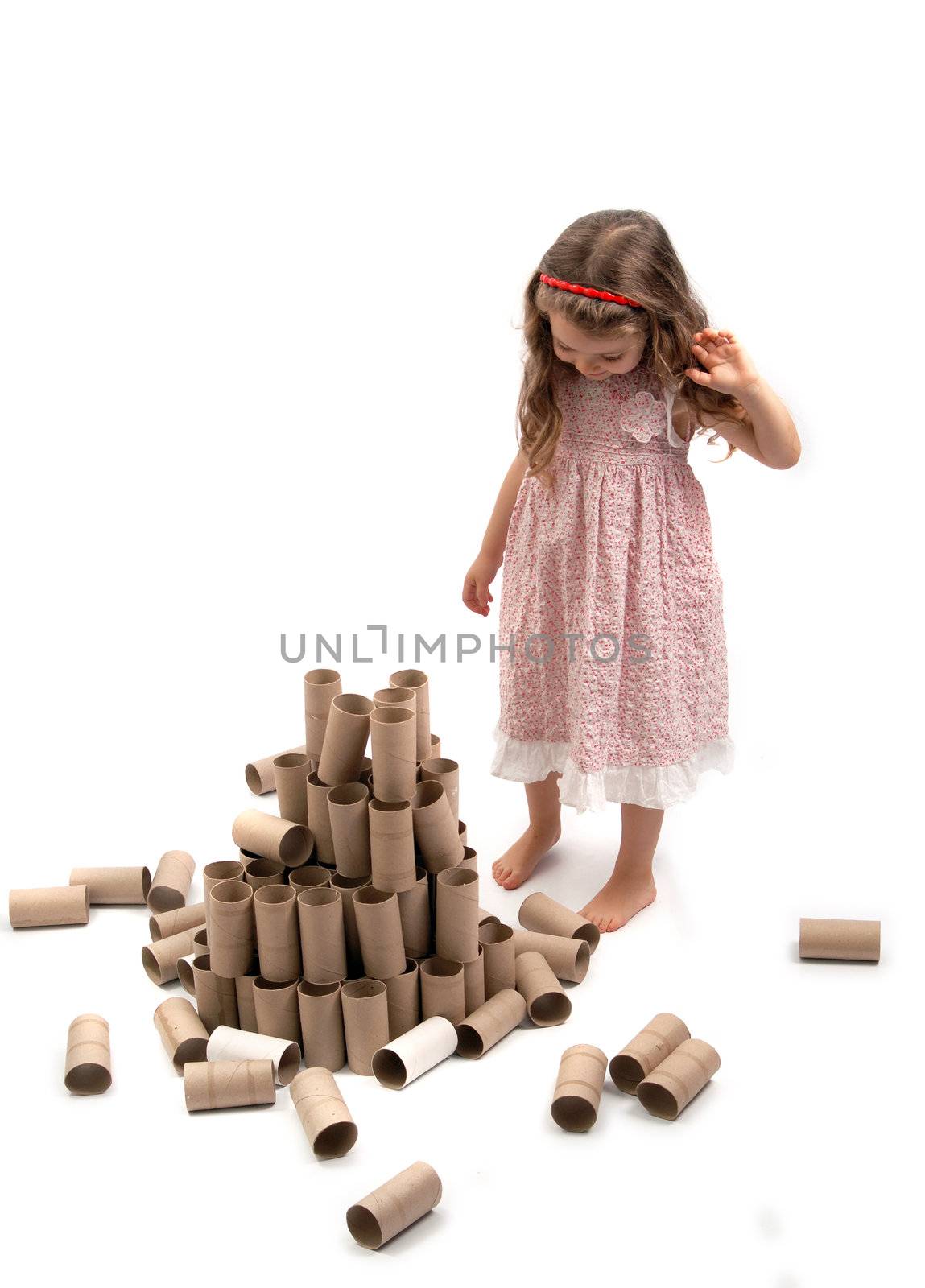 Girl and fallen paper rolls tower by cienpies