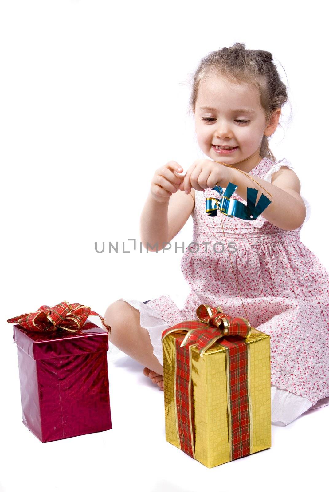 Girl about to open her Christmas presents by cienpies