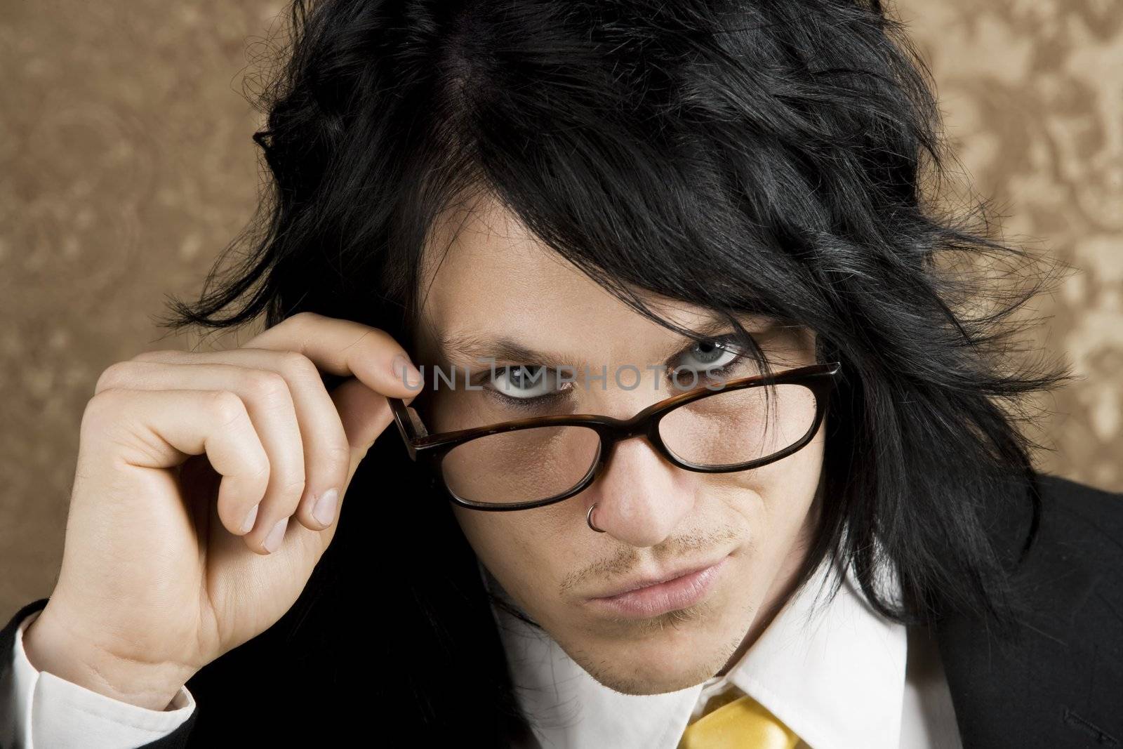 Handsome Young Man Looking Over the Top of his Glasses