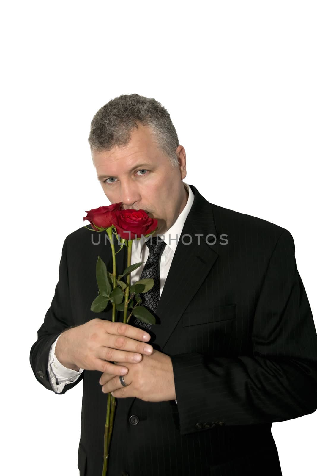 A handsome middle-aged man holding roses.