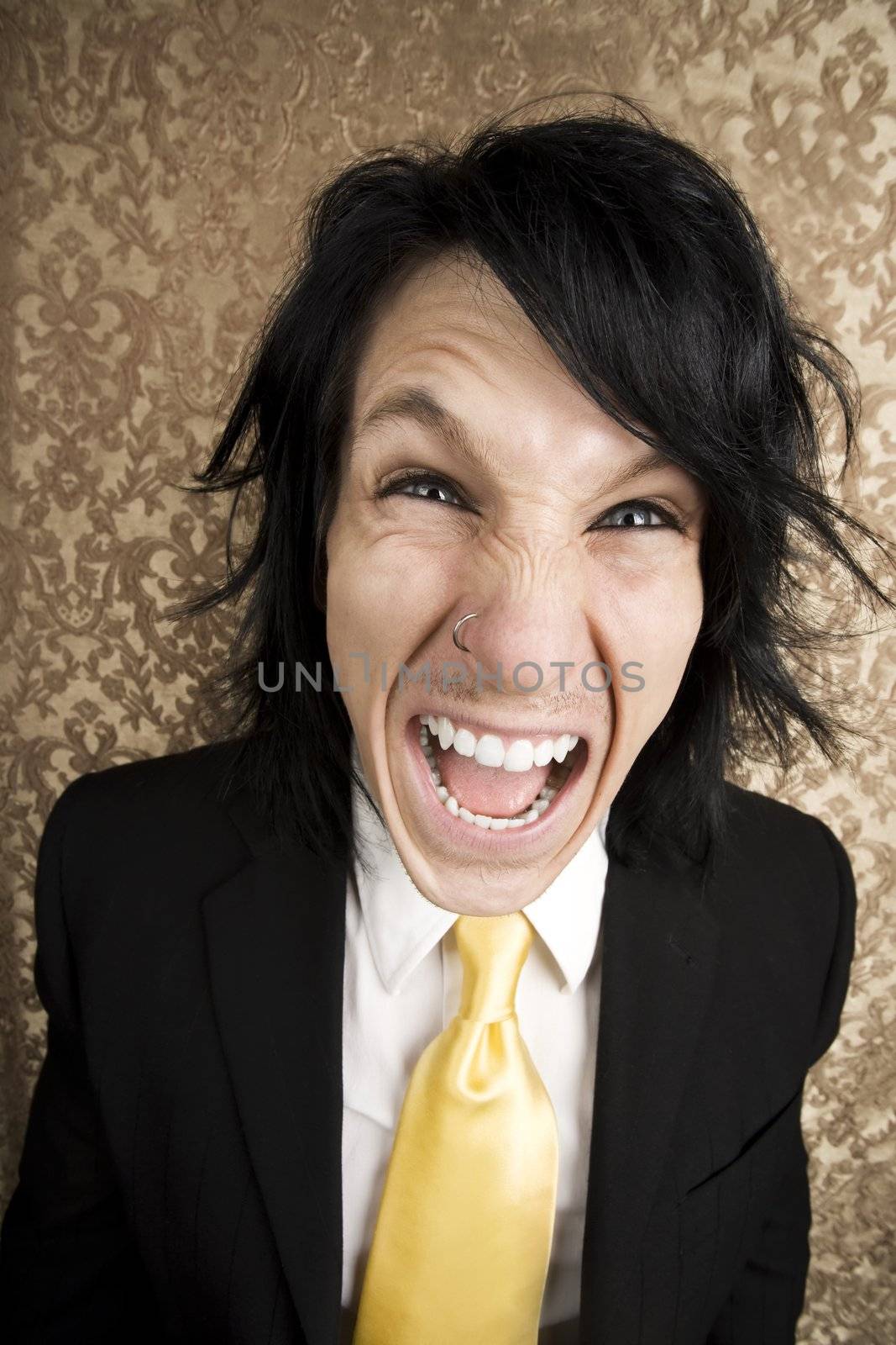 Screaming young man in a business suit and tie