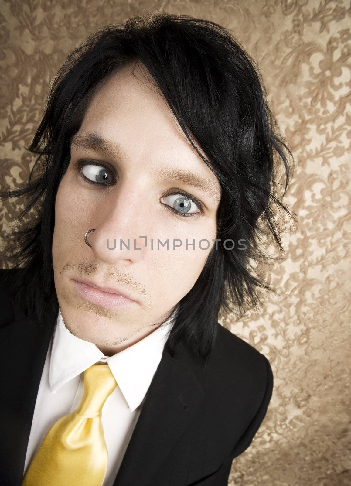 Wide Angle Closeup of Rock and Roll Businessman with Crossed Eyes