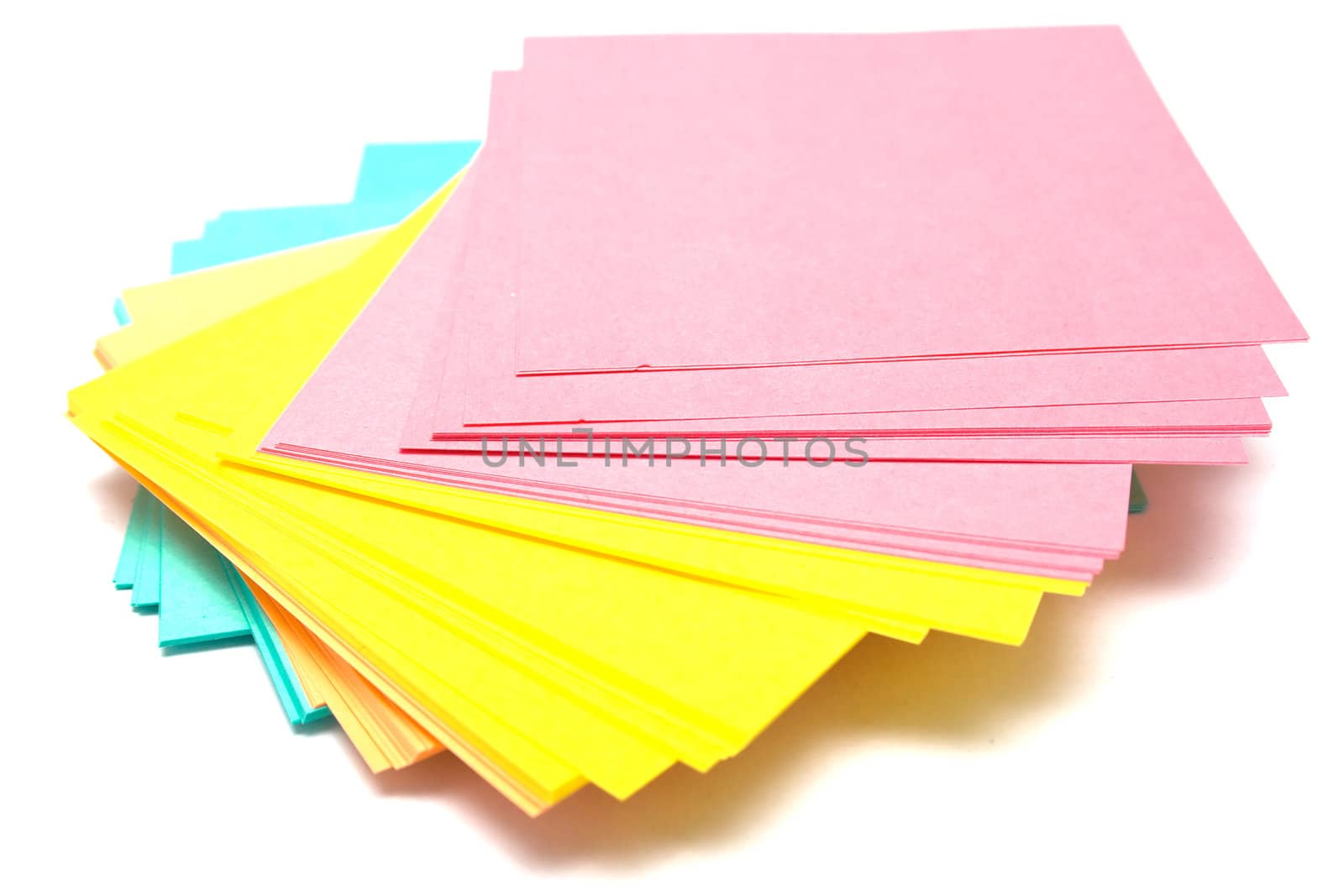 Pile of a pure paper for notes on a white background. Isolation, shallow DOF