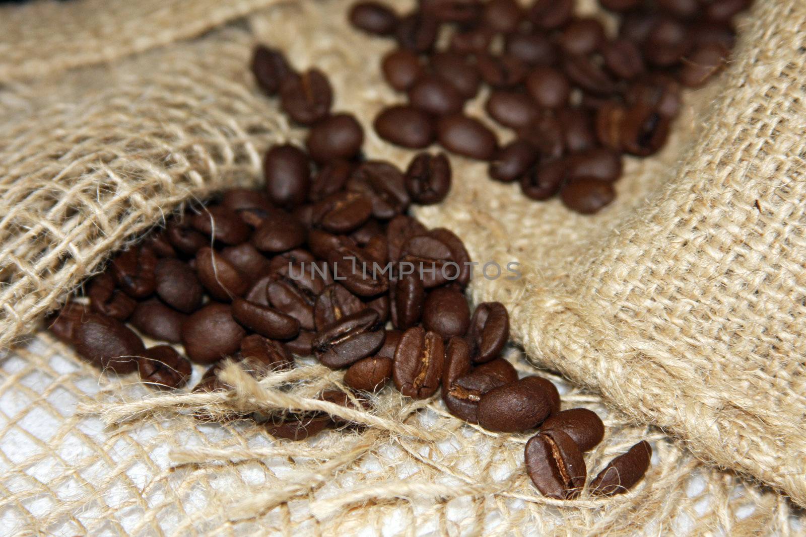 Burlap sack with coffee beans by LuBueno