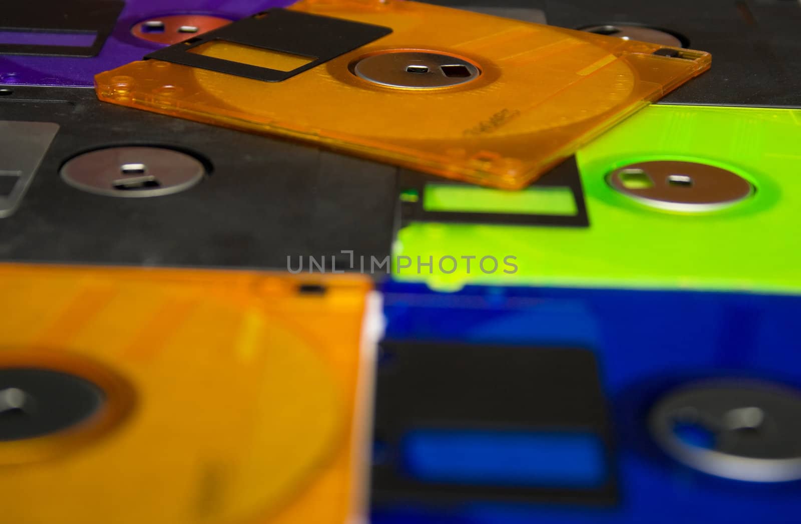 Background consisting of several diskettes of different color. Shallow DOF