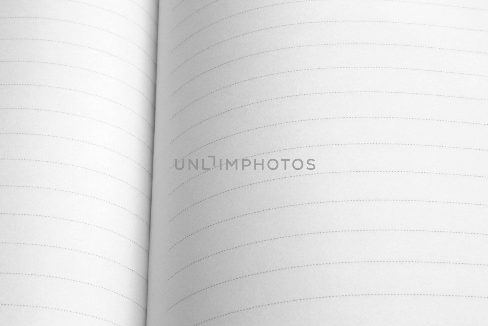 Close-up image of white lined notepad