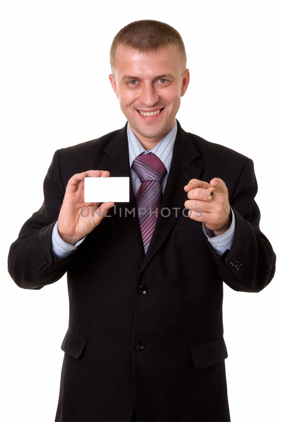smiling young businessman holding a blank business card, isolated on white background