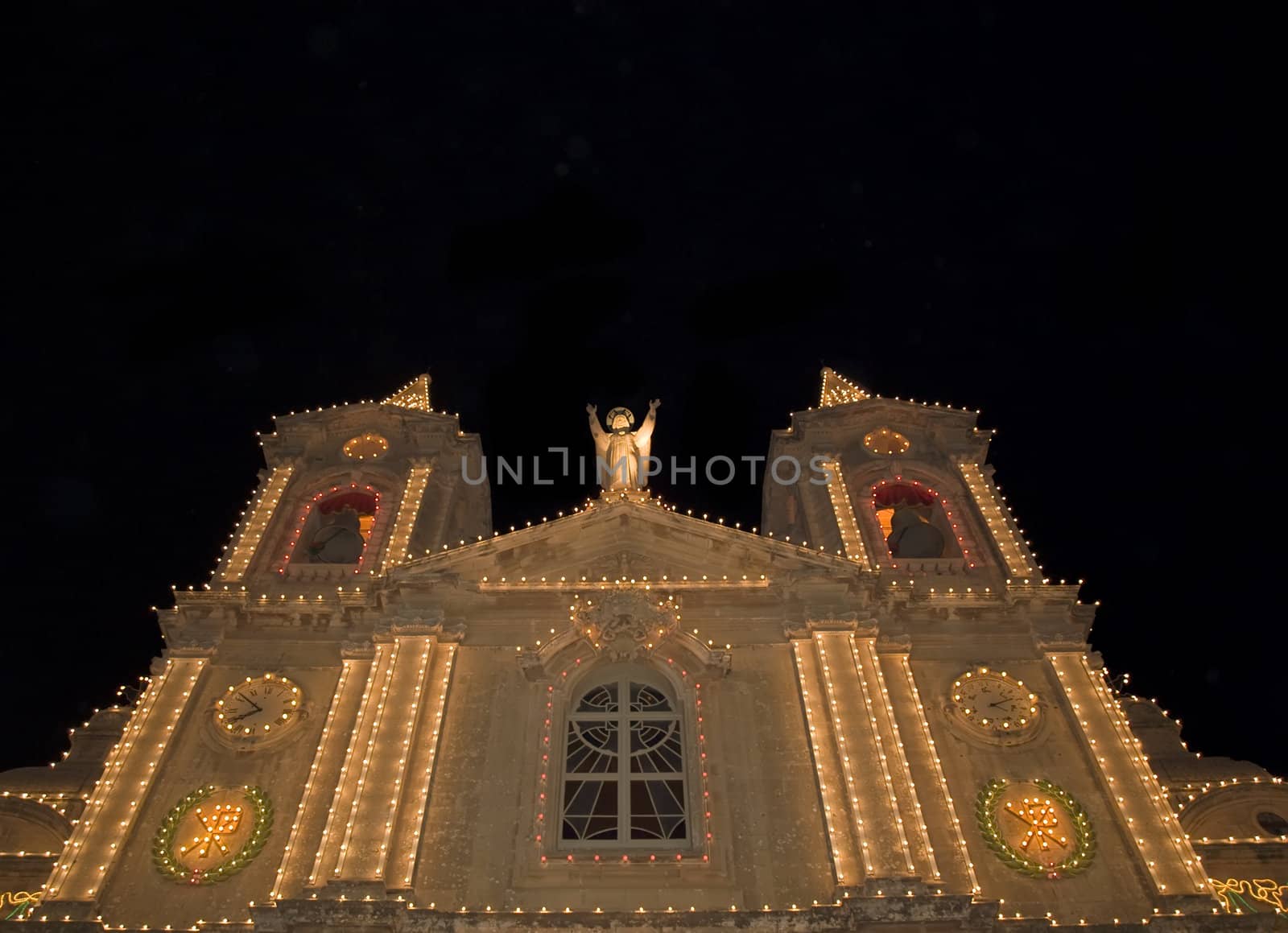 The facade of the church in the village of Zurrieq in Malta lit up for the local festa