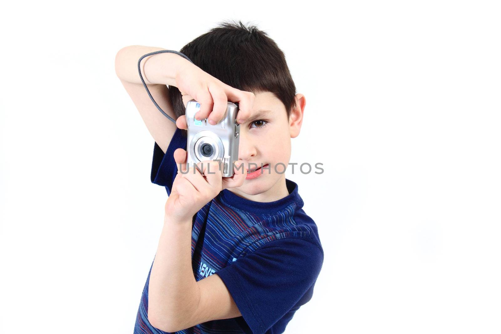 small boy photographing vertical with digital camera on white background