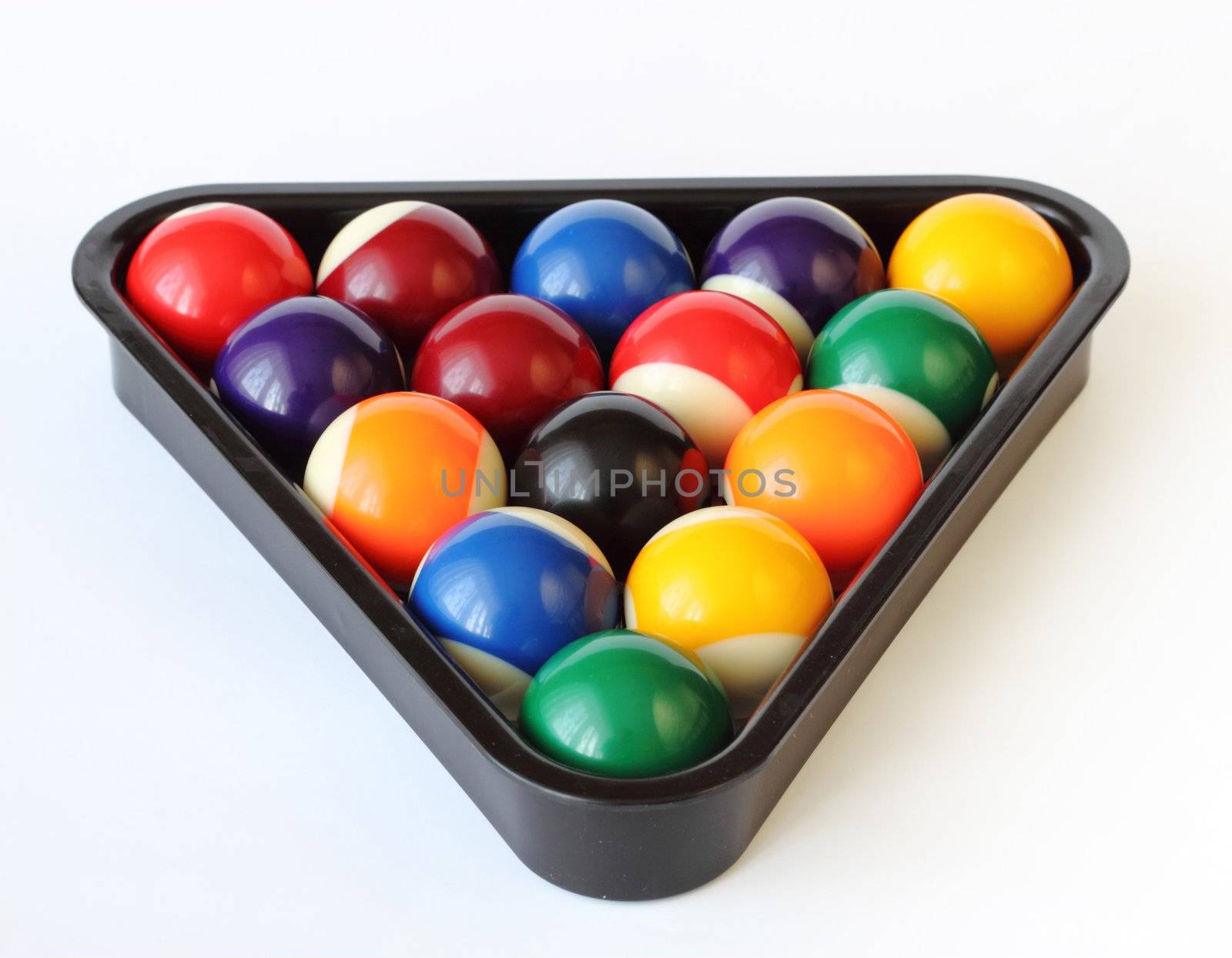 Brightly colored pool or billiard balls on white backgound