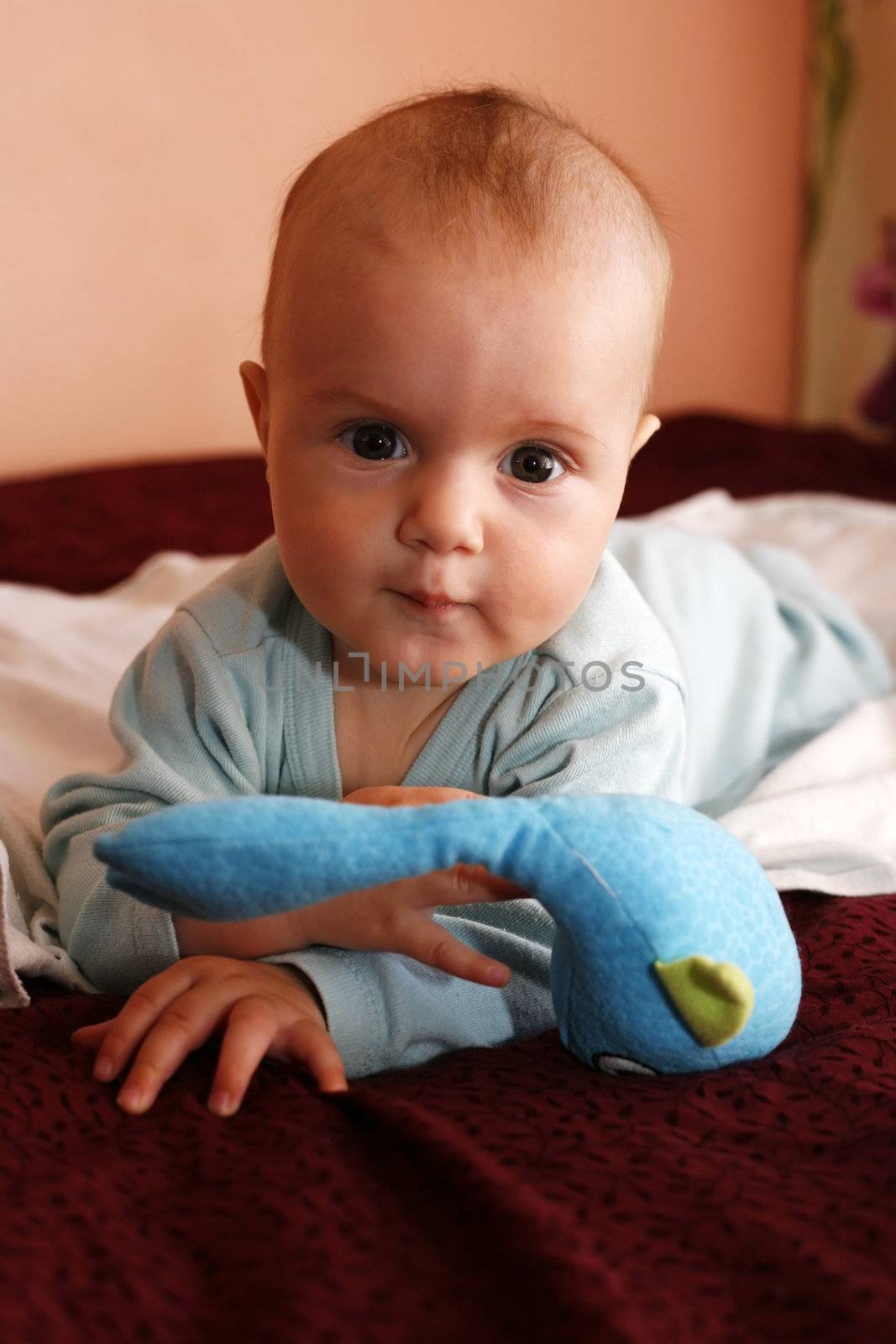 four-monthly new born child in a bed