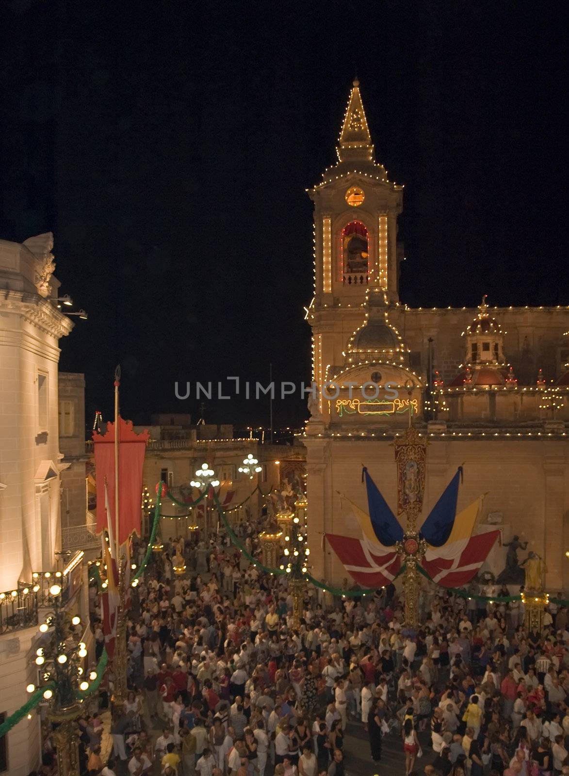 The crowd near a church at local village festa in the town of Zurrieq in Malta celebrating their patron saint St Catherine of Alexandria