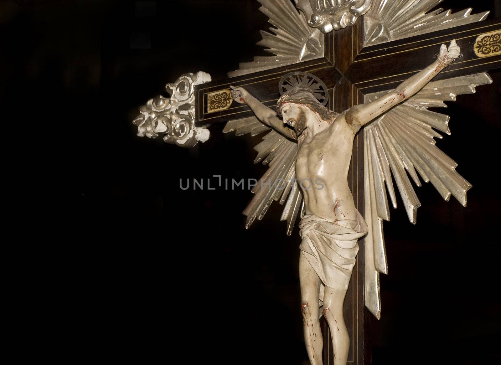 Medieval crucifix with intricate detailing carried during a procession