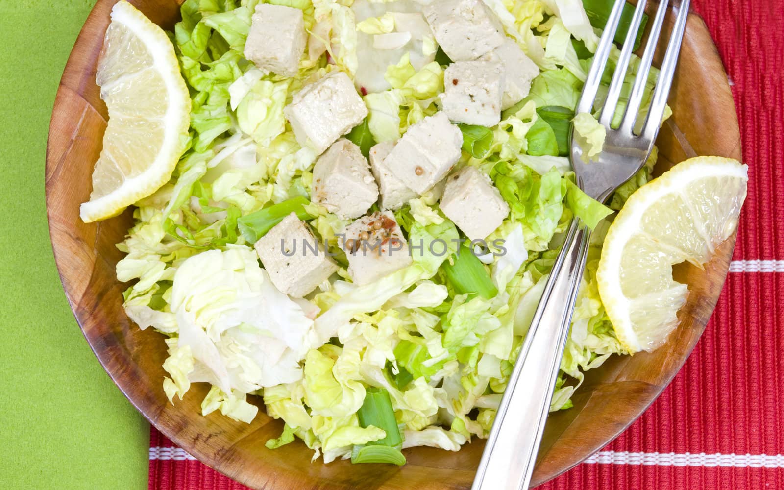 closeup on a bamboo bowl with salad