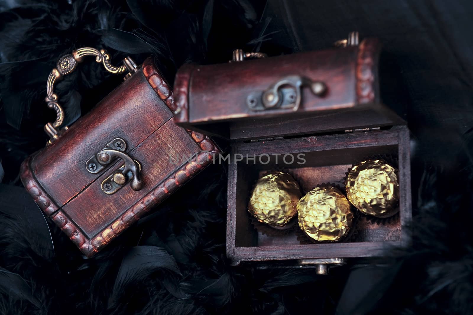 three sweets in small open treasure chest by Ansunette