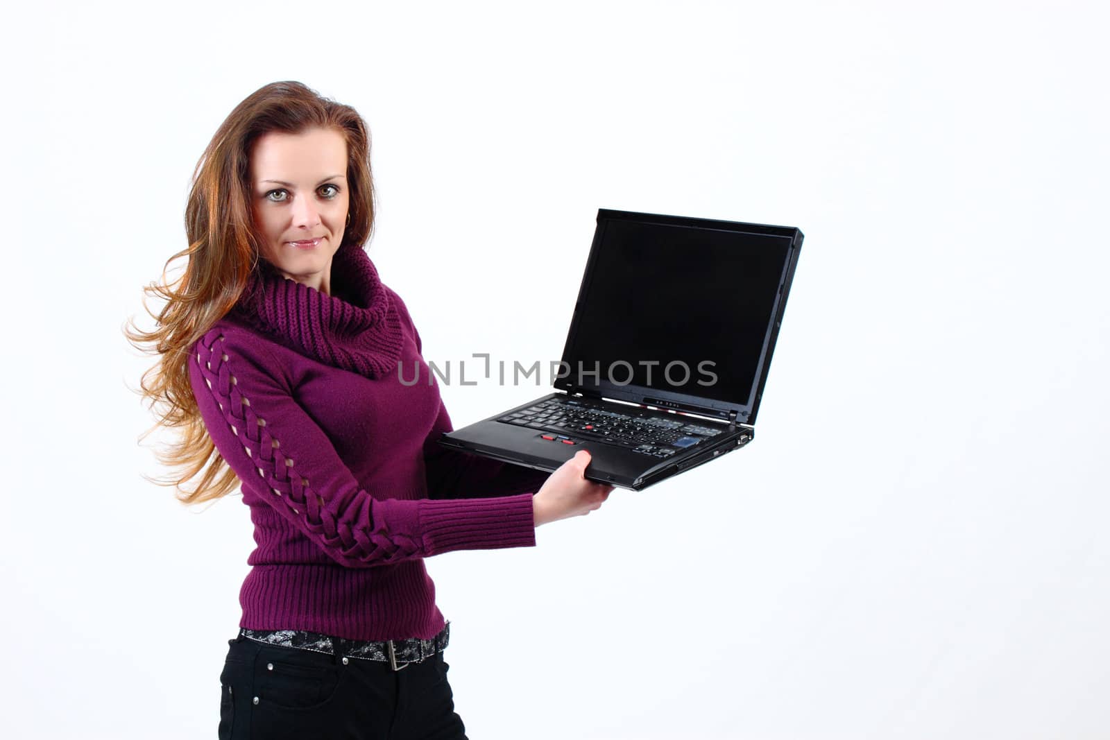 attractive woman shows her Notebook on white background