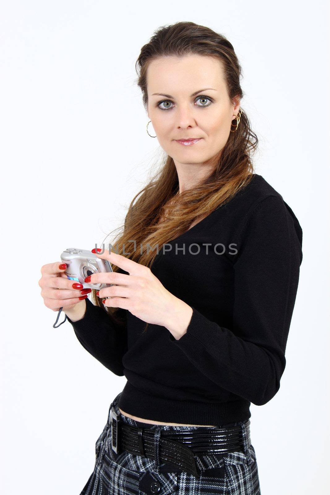 The attractive woman with digital camera  on white background 