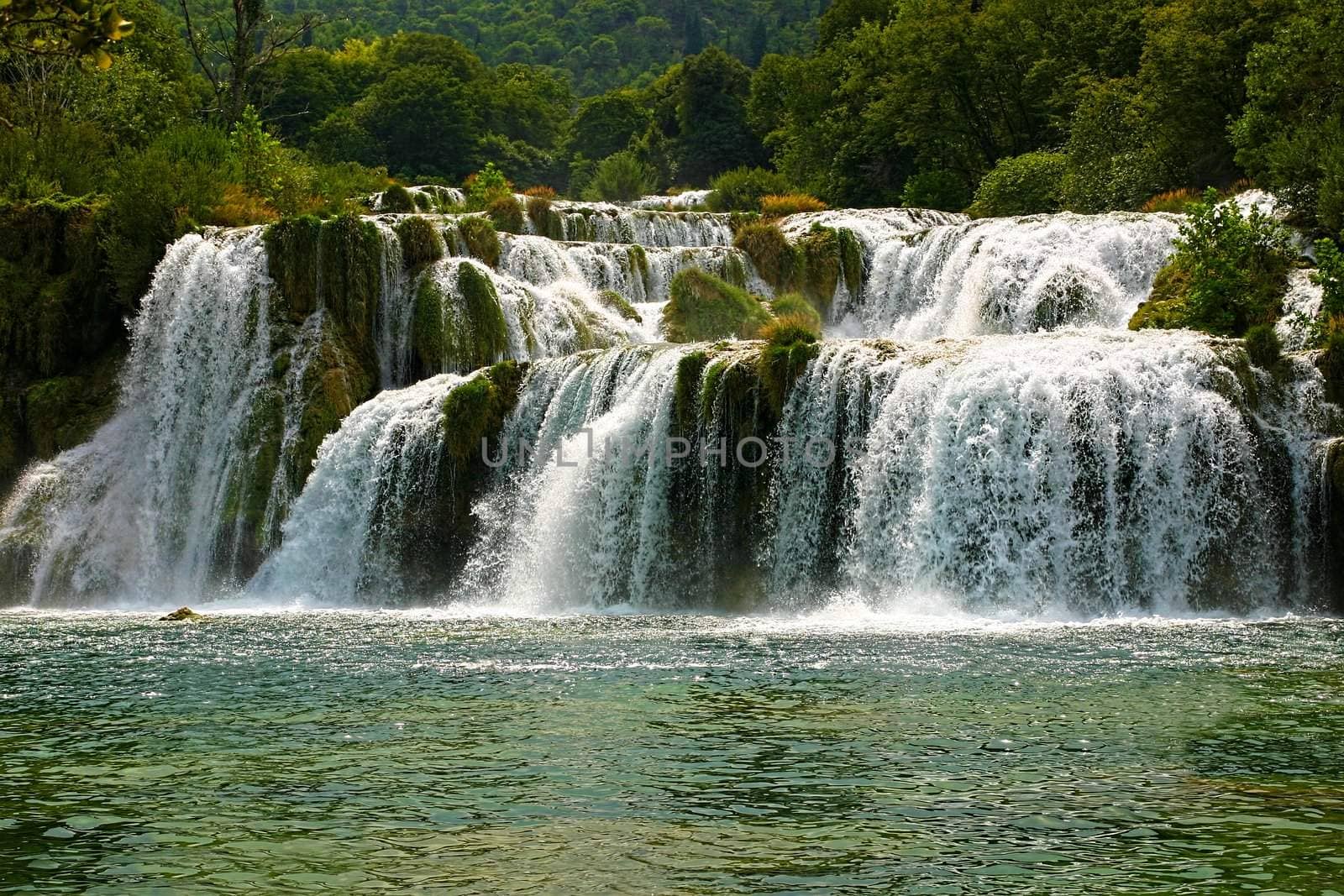 famous waterfall in national park krka - croatia by artush