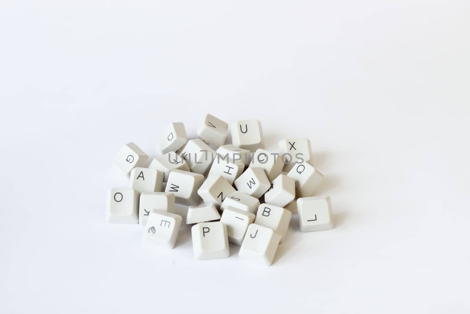 scattered keyboard keys on white  by artush