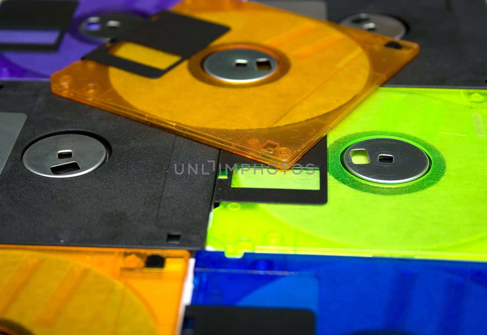 Background consisting of several diskettes of different colorA? Shallow DOF