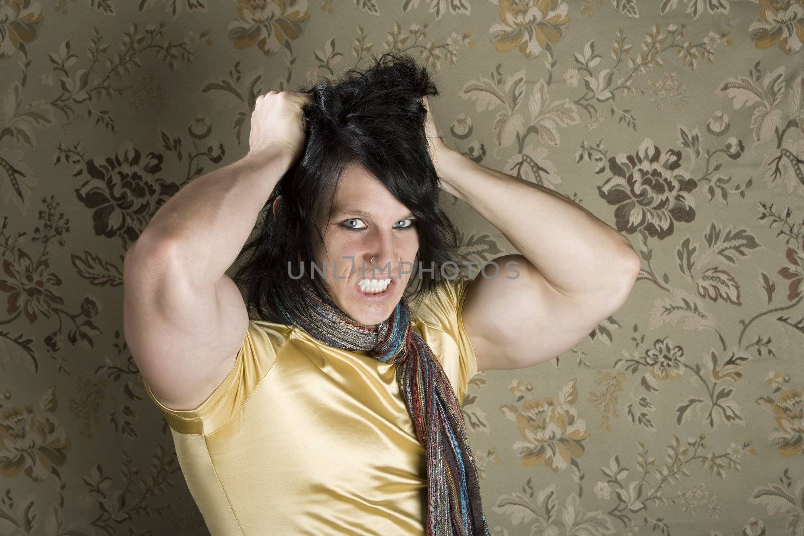 Frustrated Muscular Young Man Pulling Out His Black hair