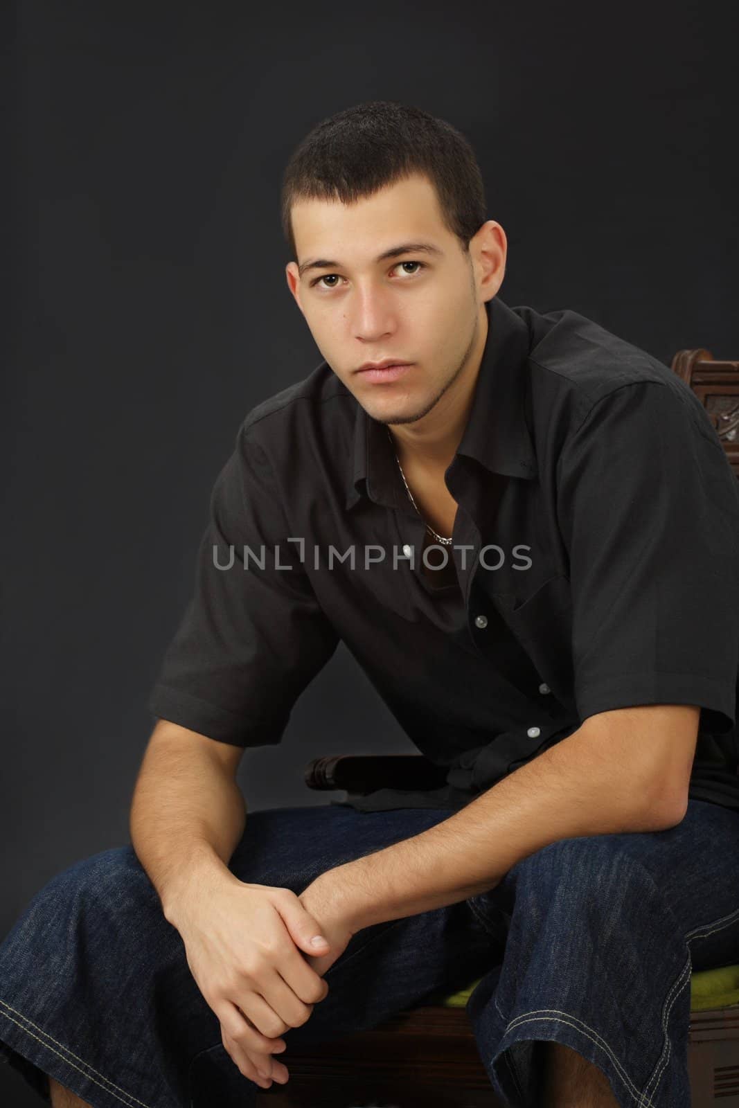 young caucasian man,, black background