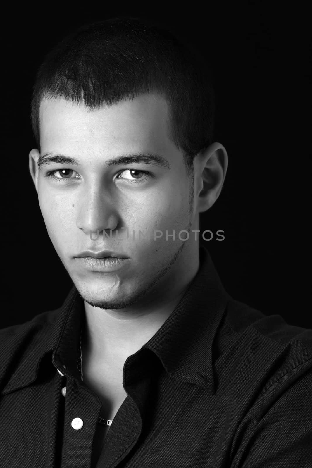 young caucasian man, black background