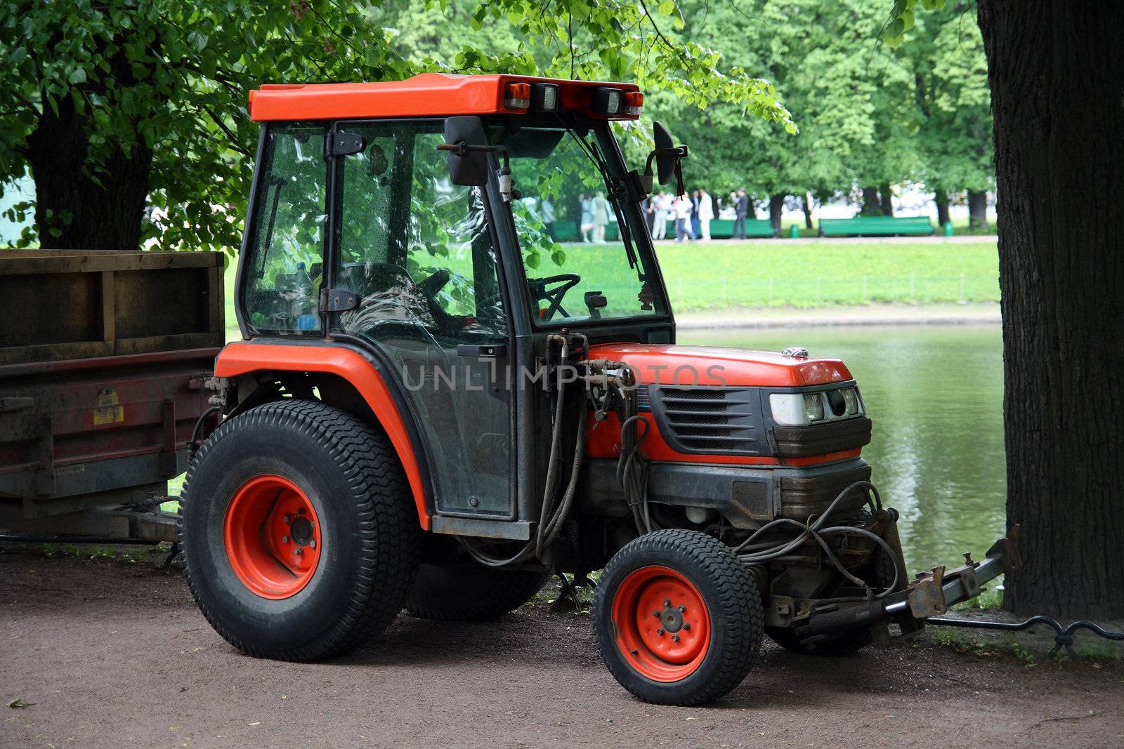 small red tractor in park