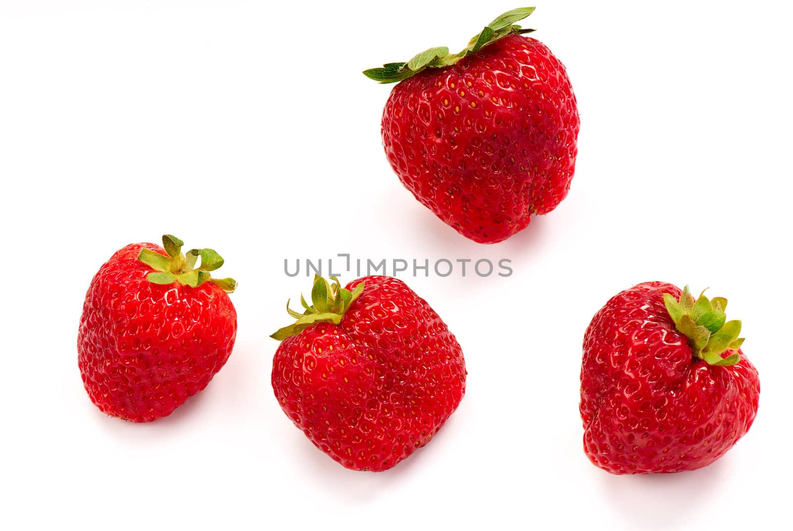 Four fresh red summer strawberry with green leaf on white background. Close up.