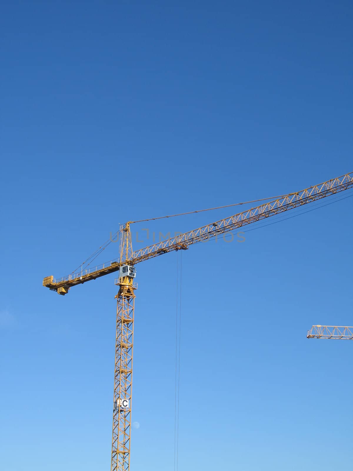 yellow construction crane by mmm