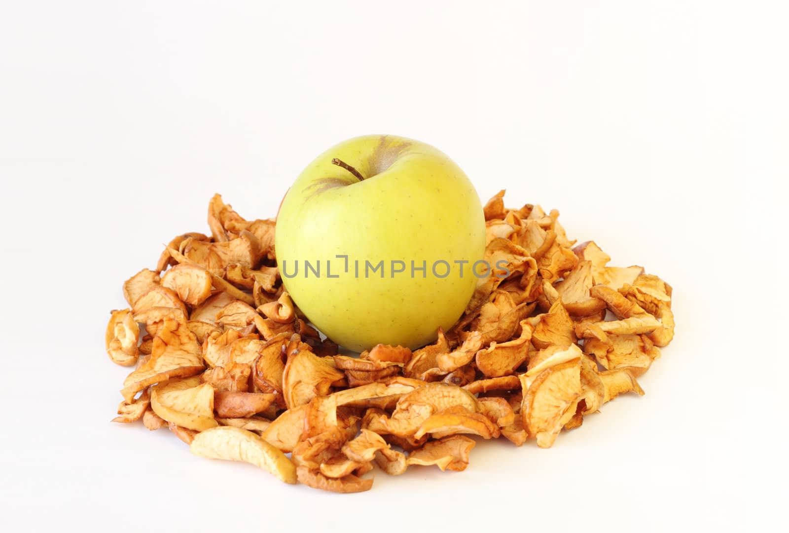 green and dried apples on white background