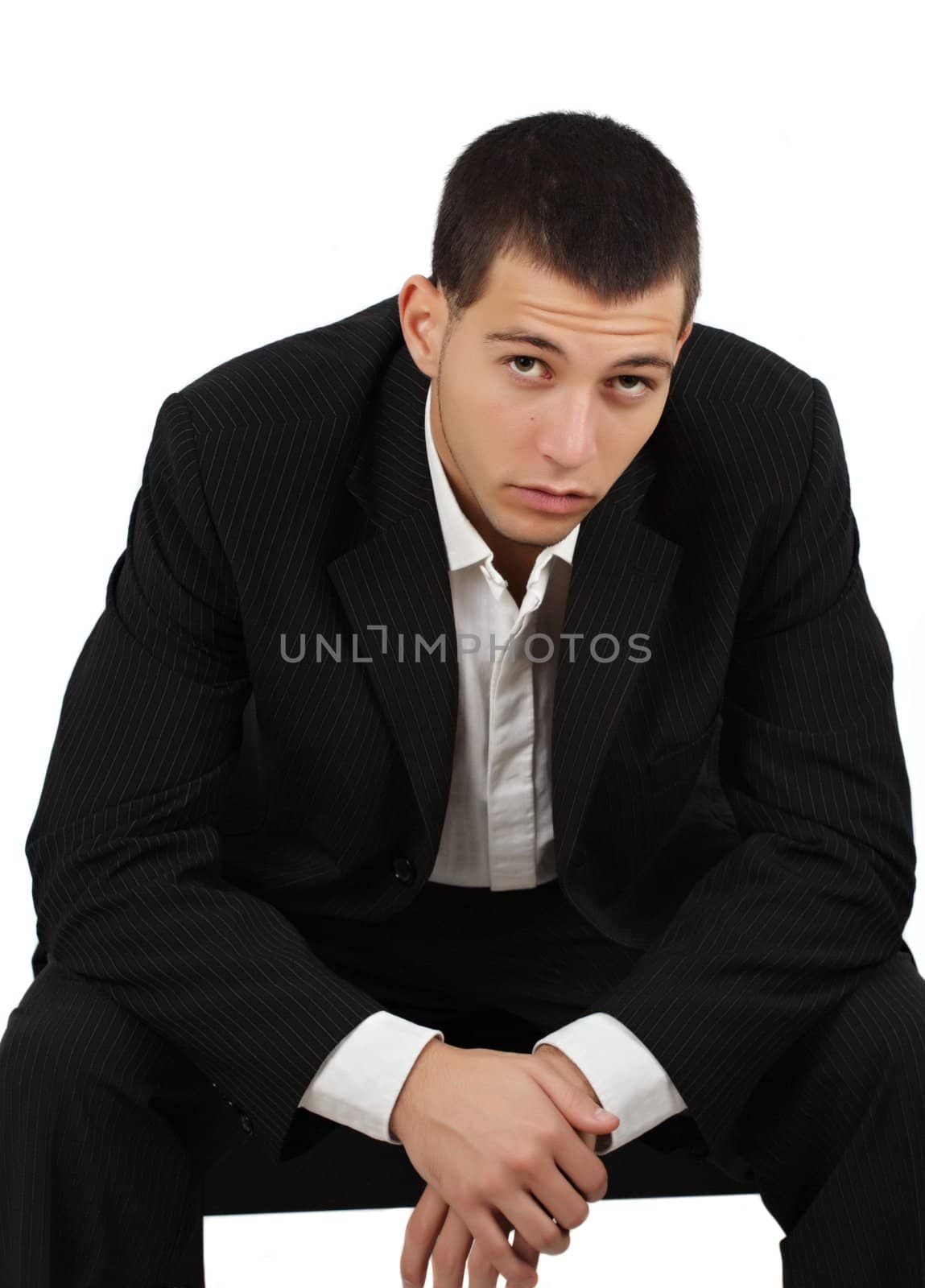 young caucasian man wearing tuxedo, white background