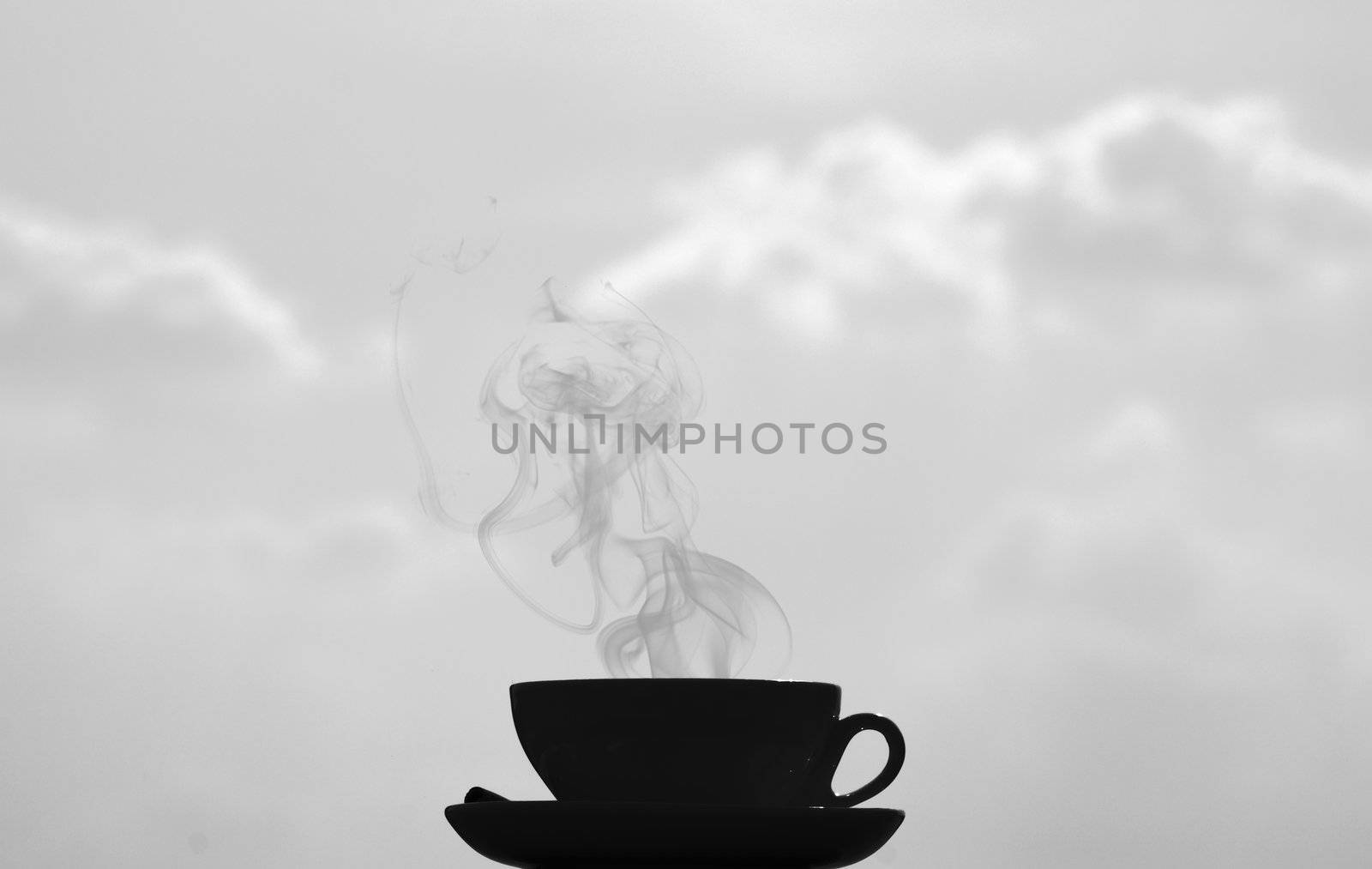 black and white shot, big contrast, coffee cup on clouds background