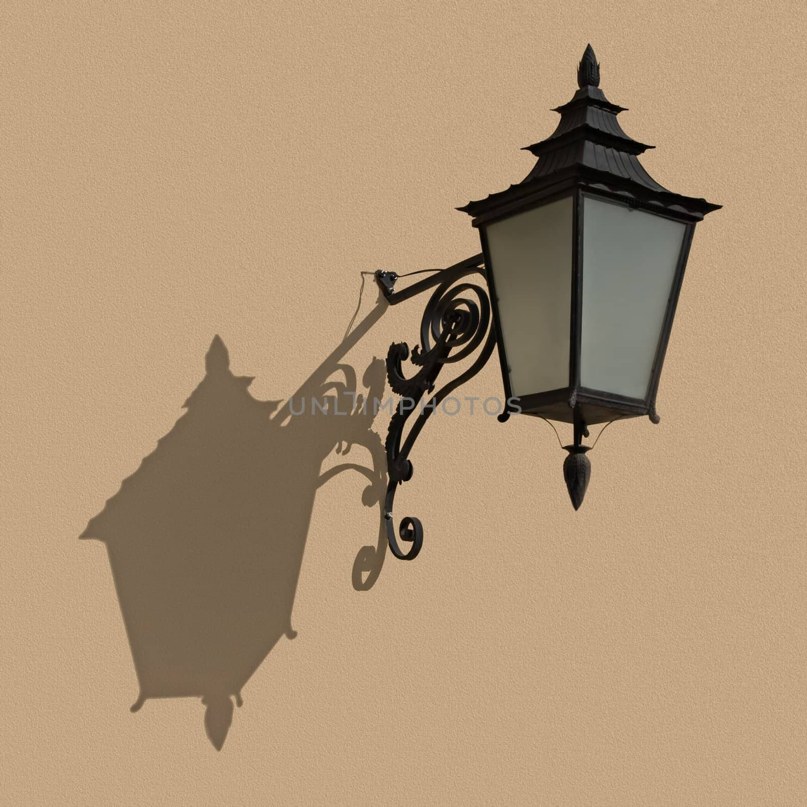 An old-fashioned lantern hanging on a wall