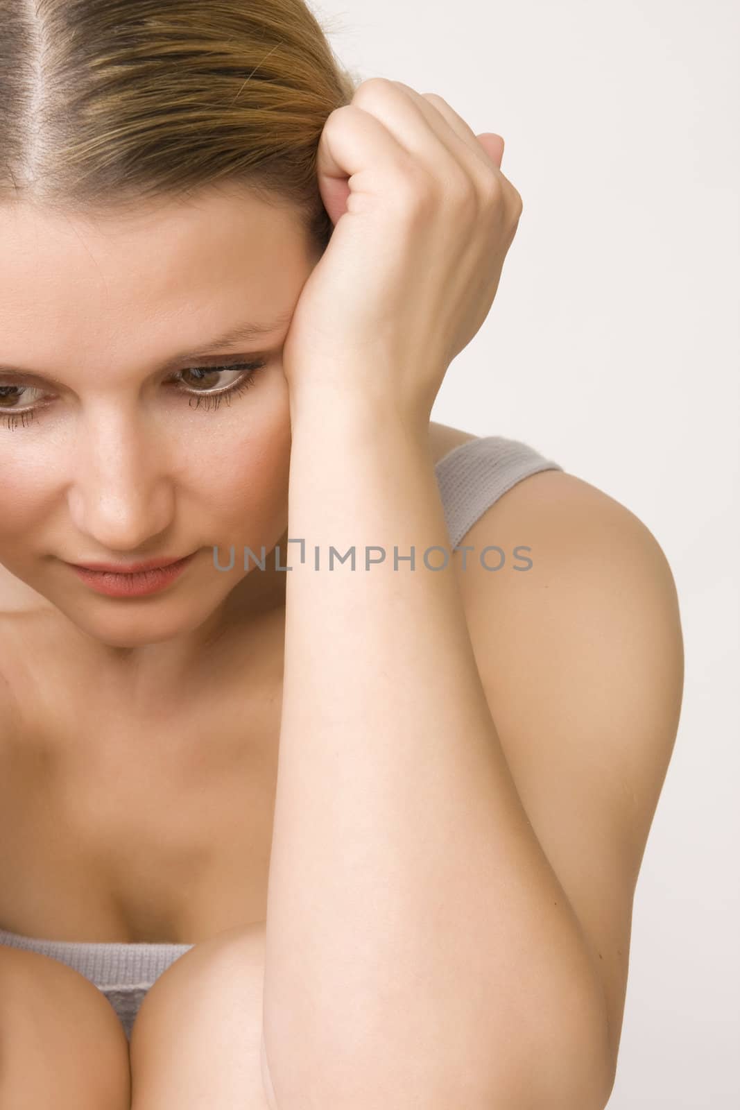 portrait of sad beautiful woman on white background