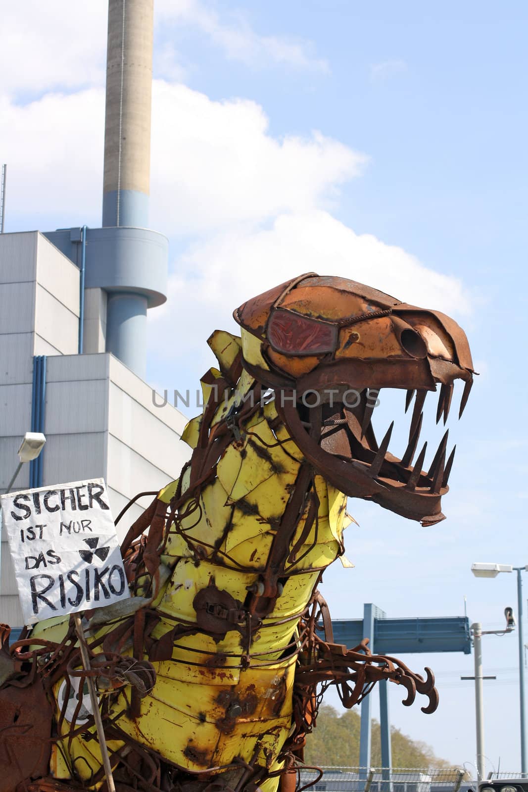 Anti-nuclear power protest at Krümmel Nuclear Power Station in Geesthacht, near Hamburg, Germany. 24th April 2010. German text on rusty monster says "Only the risk is guaranteed."