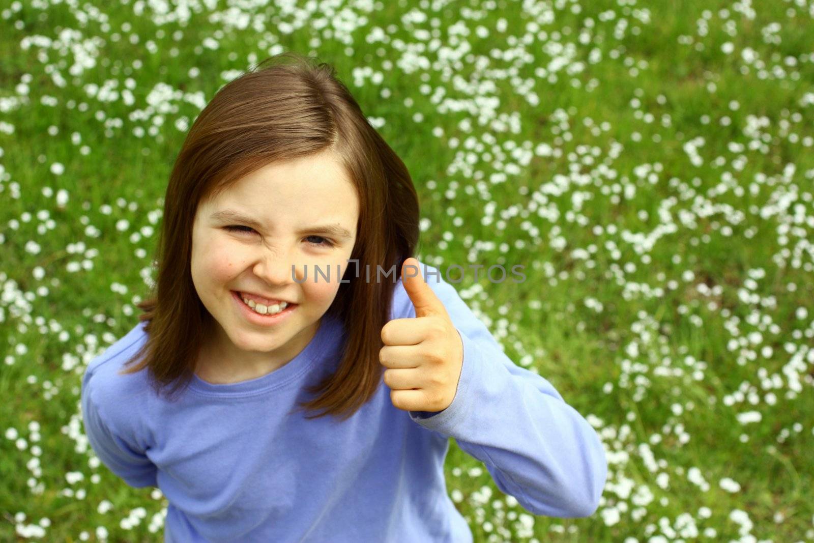 Cute girl with thumb up