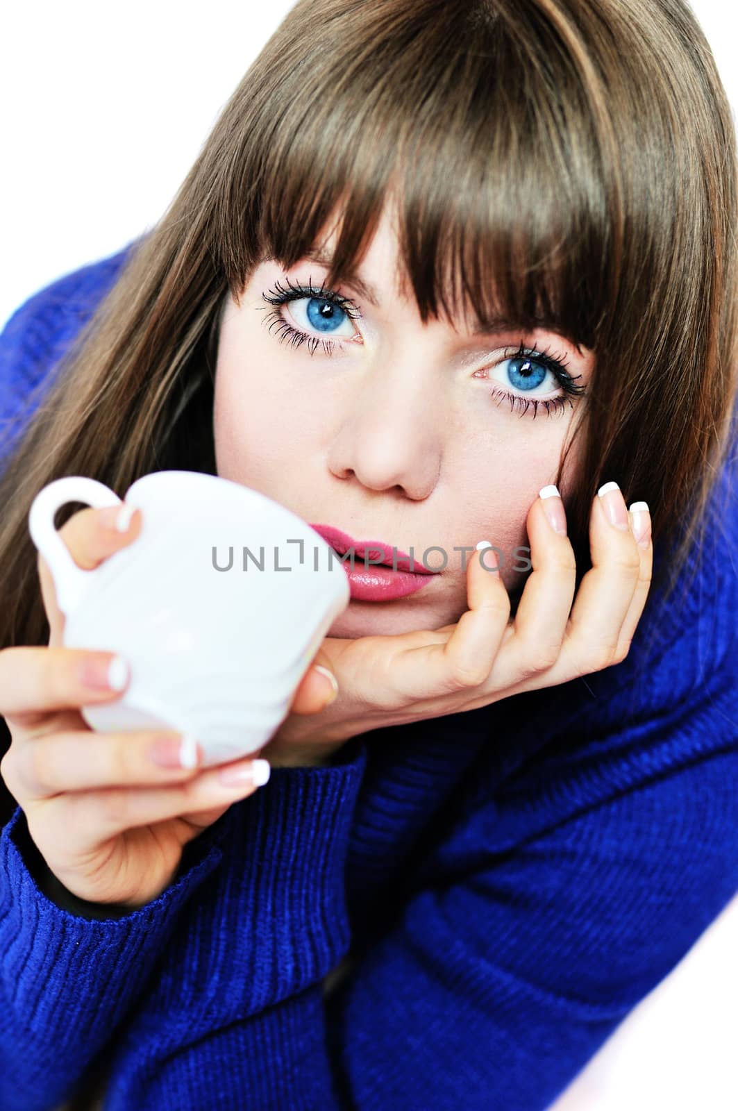 blue-eyed drinking girl wearing blue sweater