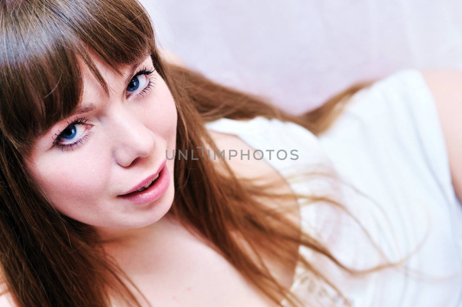  Portrait of young beauty  laying woman 