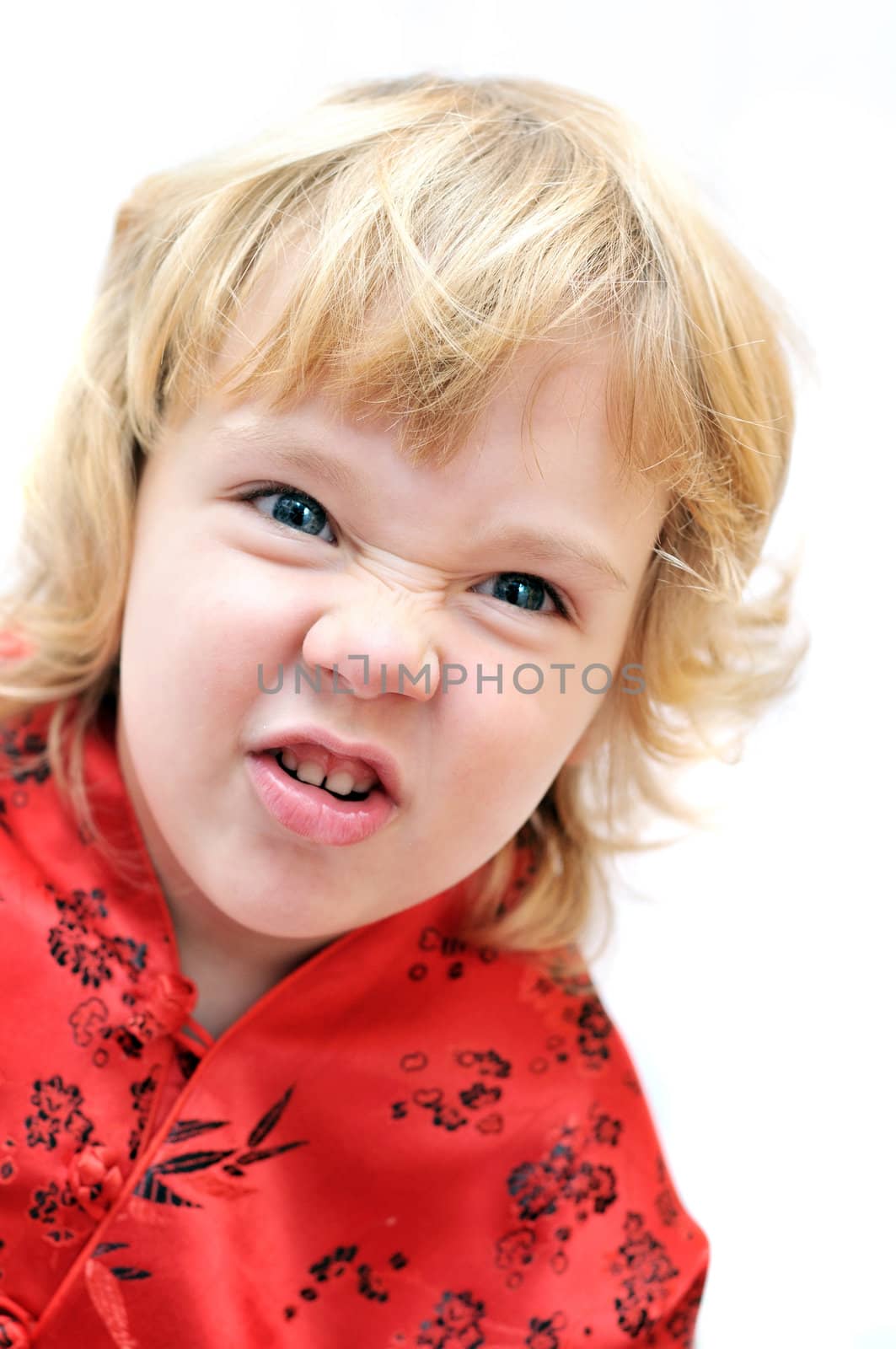 little blonde lovely girl is grimacing like a monkeyish