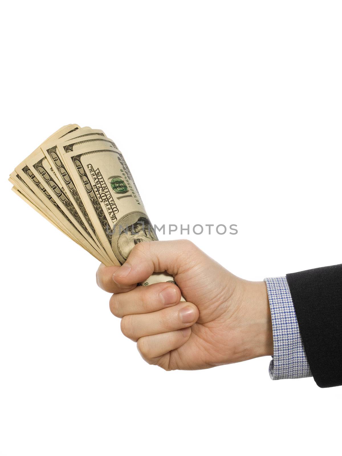 A man's hand holding a handful of dollars.