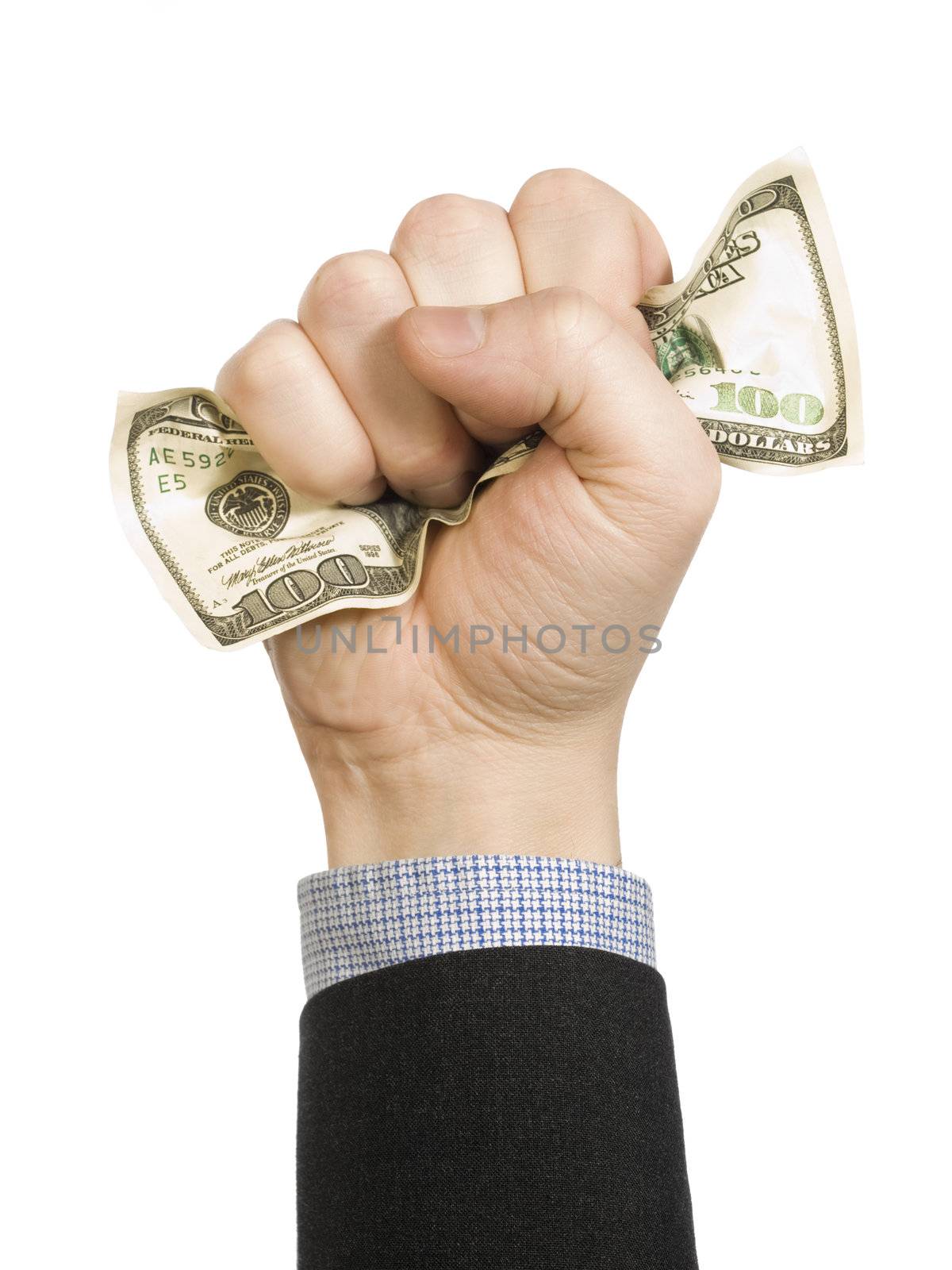 A man�s fist wrapping a one hundred dollar bill with his hand.