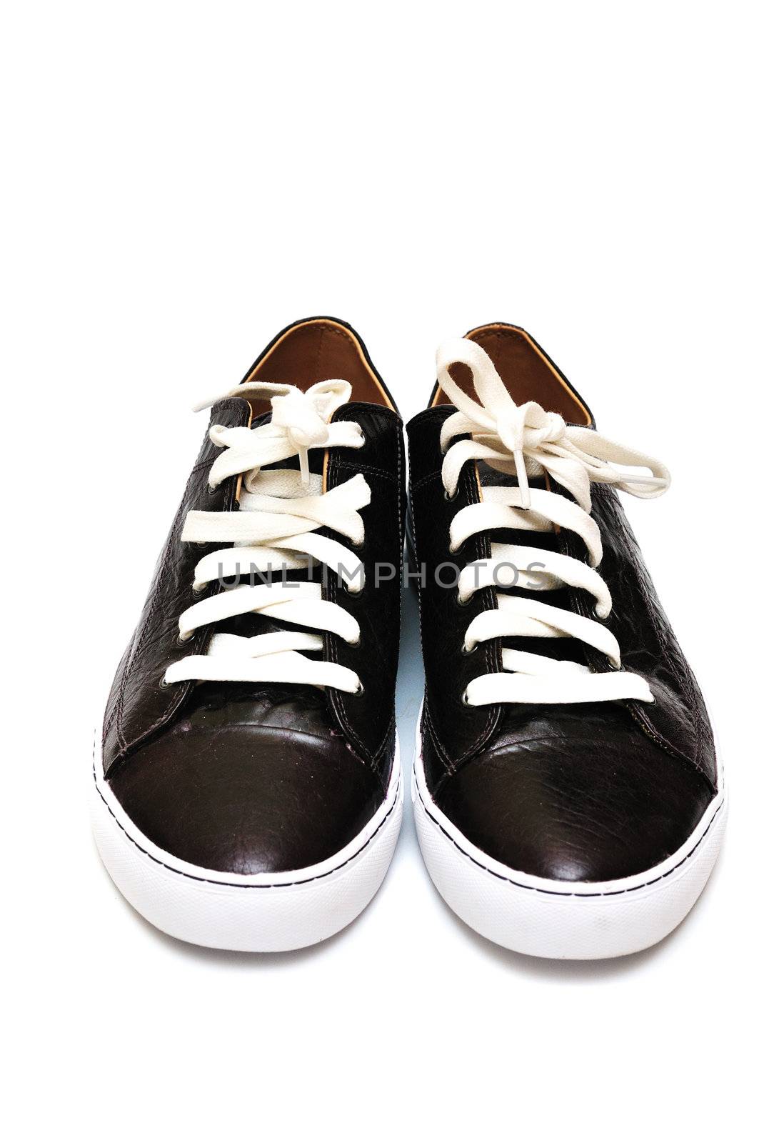 Sport leather man's shoes over the white
