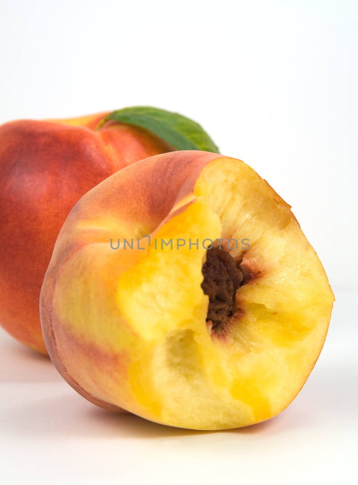 Nectarine and bited peach by serpl