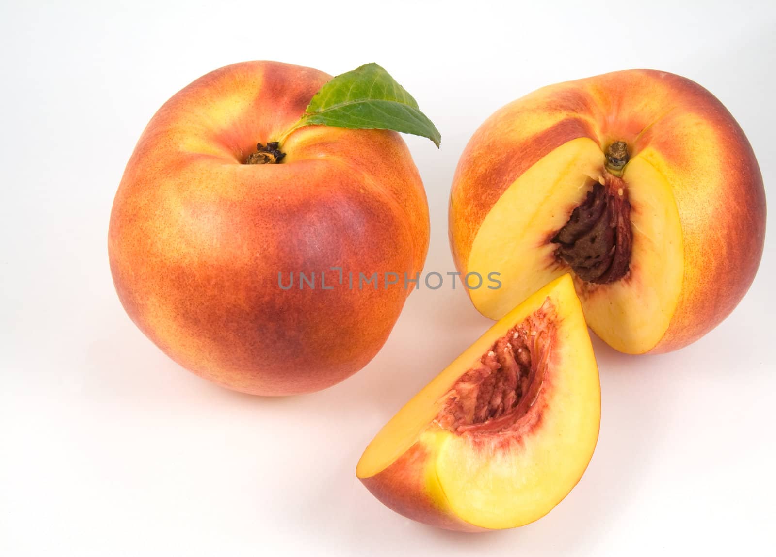 Ripe nectarines on white background