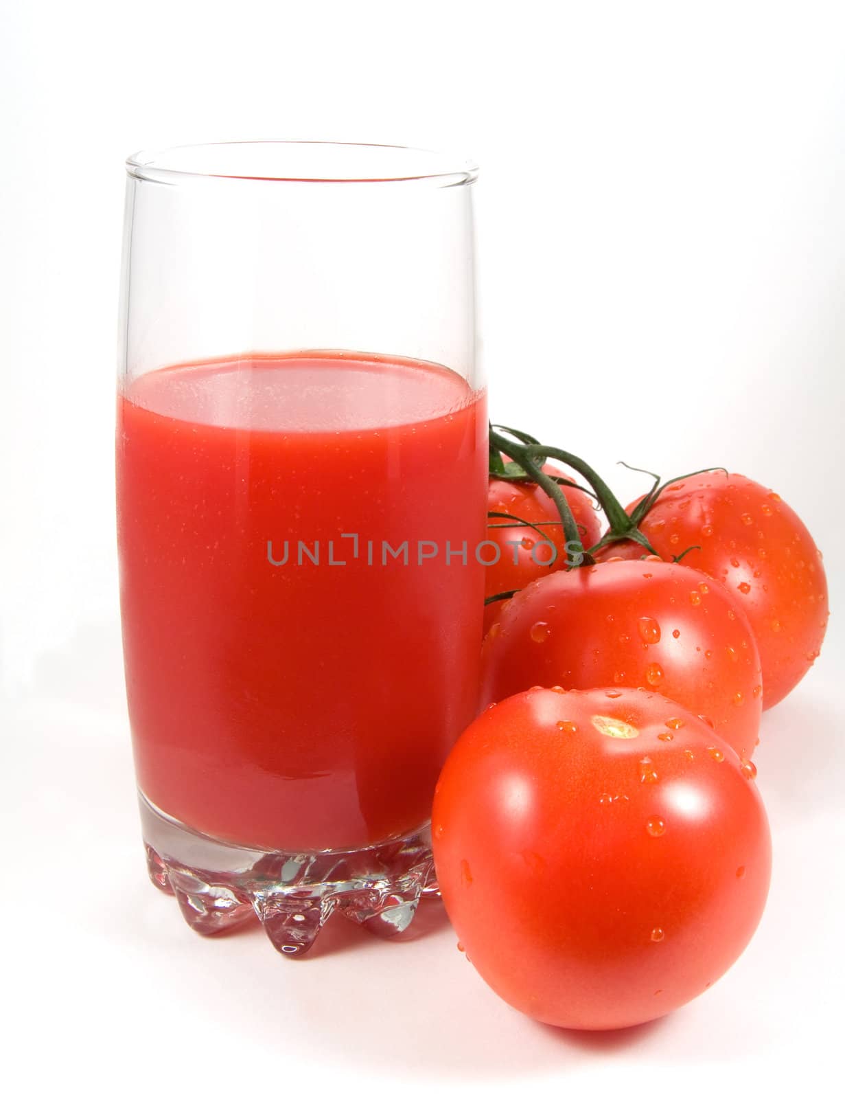 Tomatoes and glass of juice by serpl