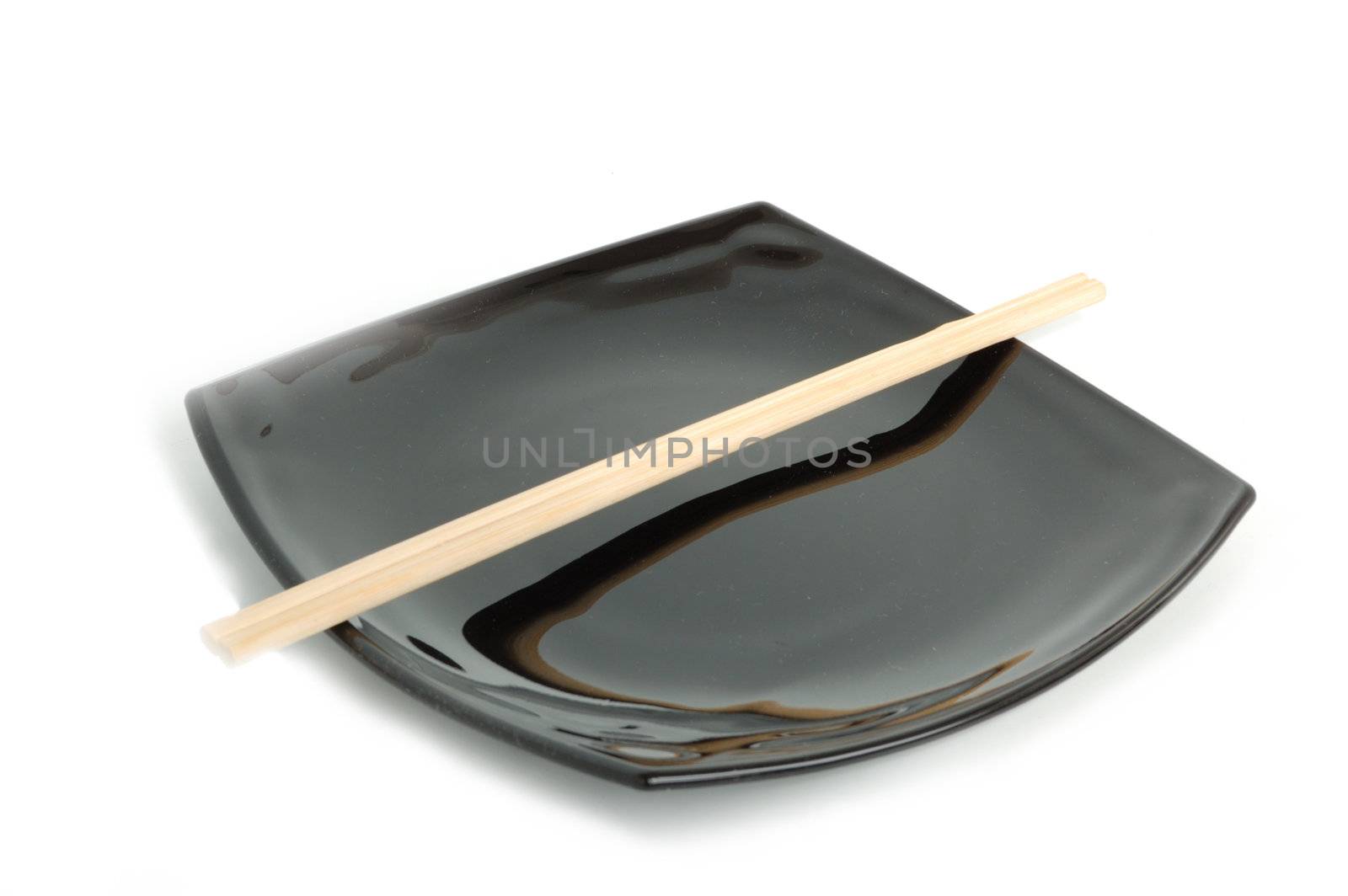 diet concept - empty black asian plate and chopsticks