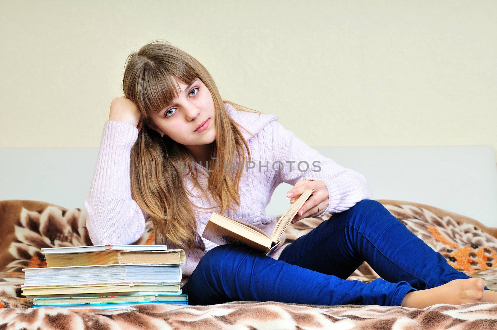 bored girl with books doing her homework