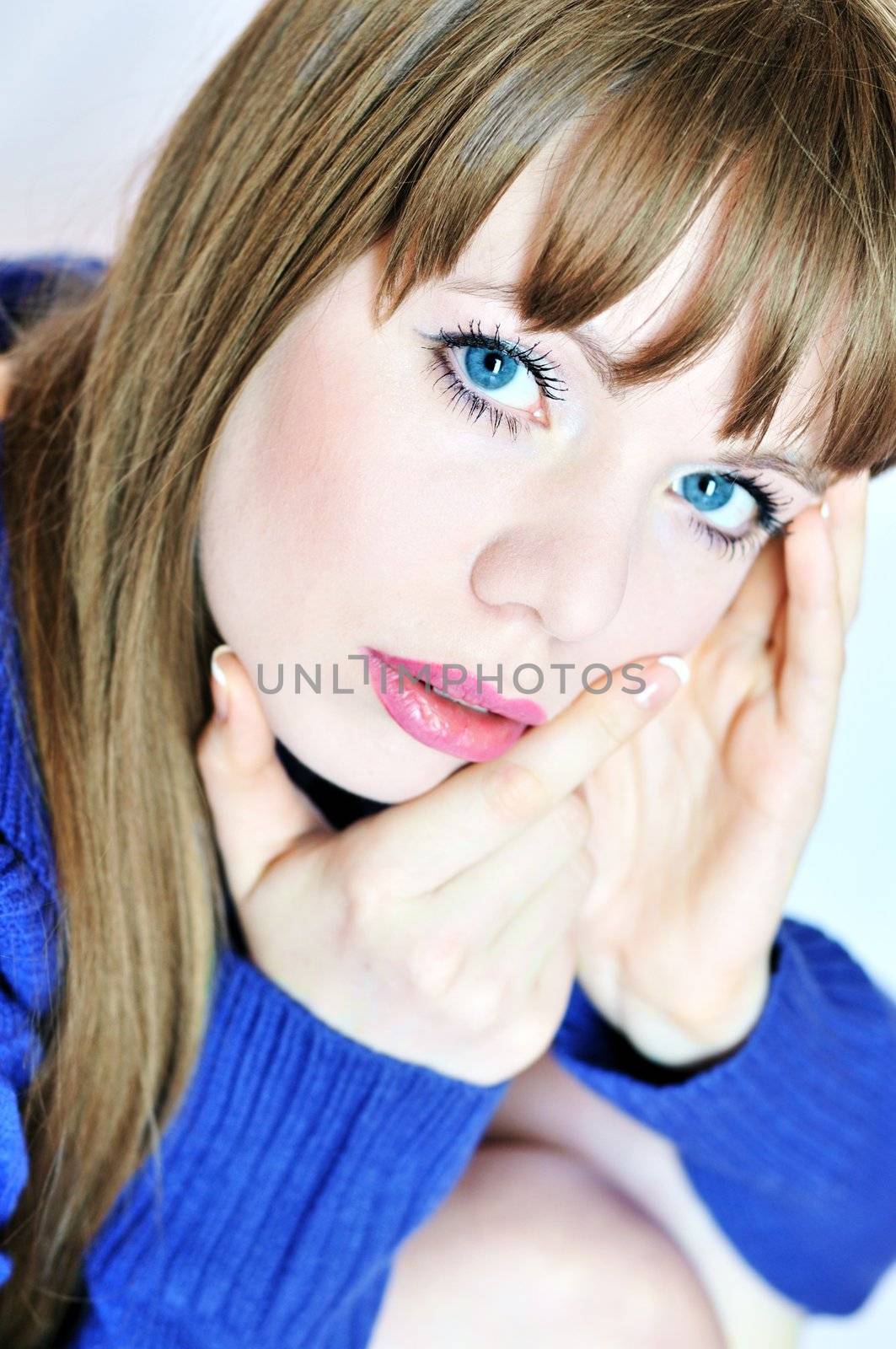  thoughtful lovely young woman with her hands near face
